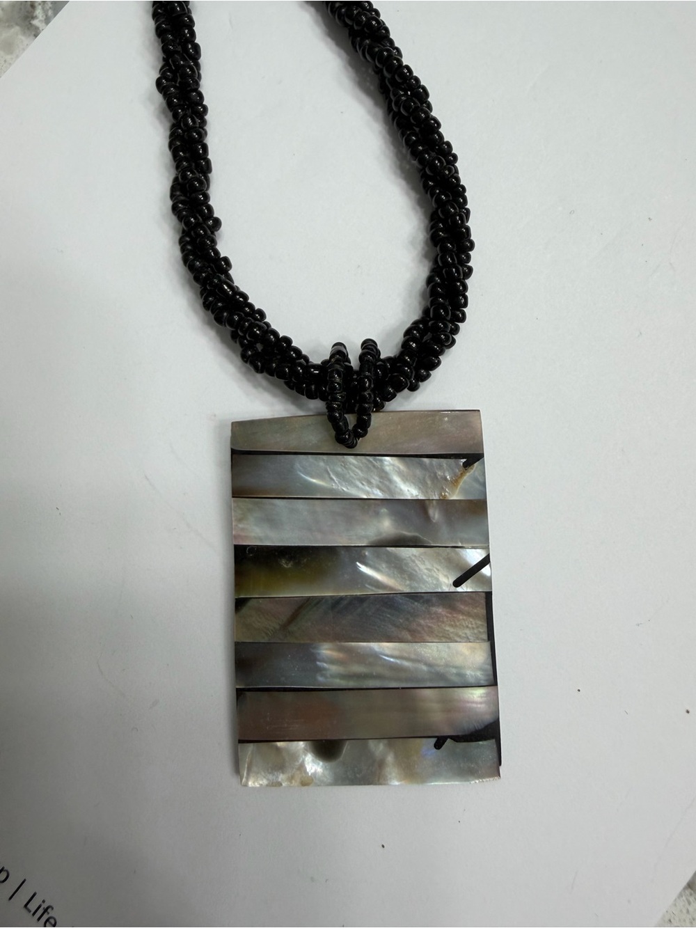 Black Beaded Necklace with Iridescent Mother-of-Pearl Pendant